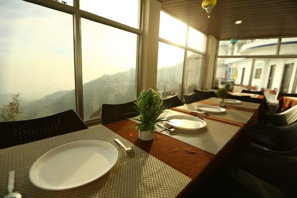 View of the valley from inside the restaurant at Hotel Mayur